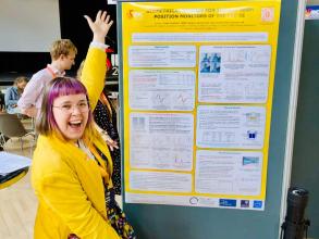 Emily Howling exhibiting her poster at IBIC 2025
